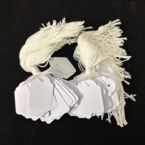 White Card tickets with white cotton strings (bags of 500).