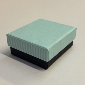 Quality Cardboard Medium Universal box, Turquoise lid with black base with black inserts.