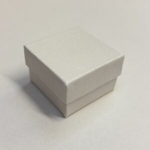 Cardboard Ring boxes with a white lift off lid with white base. Lined with black inserts 44 x 48 x 32mm.