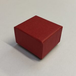 Cardboard Ring boxes with red lift off lid with black base. Lined with black inserts 44 x 48 x 32mm