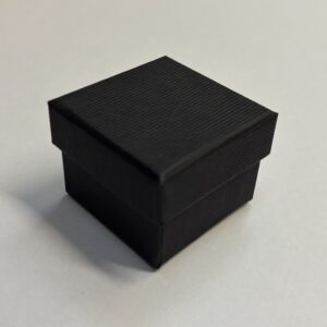 Quality Cardboard Ring box with a matt black corded texture.